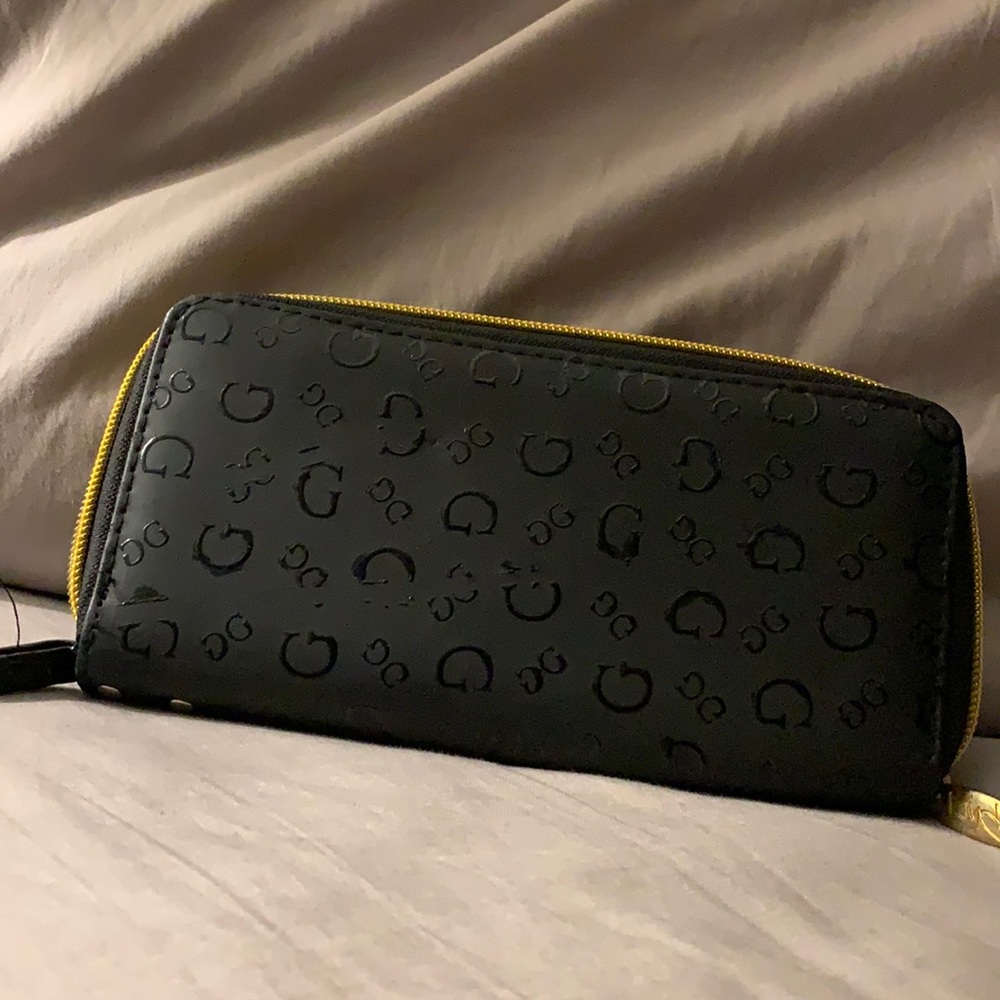 Wallet.with wrist strap and gold zipper